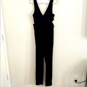 Rolla Coster Black Jumpsuit with Plunging Neckline and Defined Waist